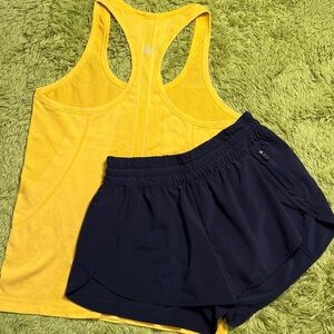 Yellow Lululemon Swiftly Tank and Navy Shorts